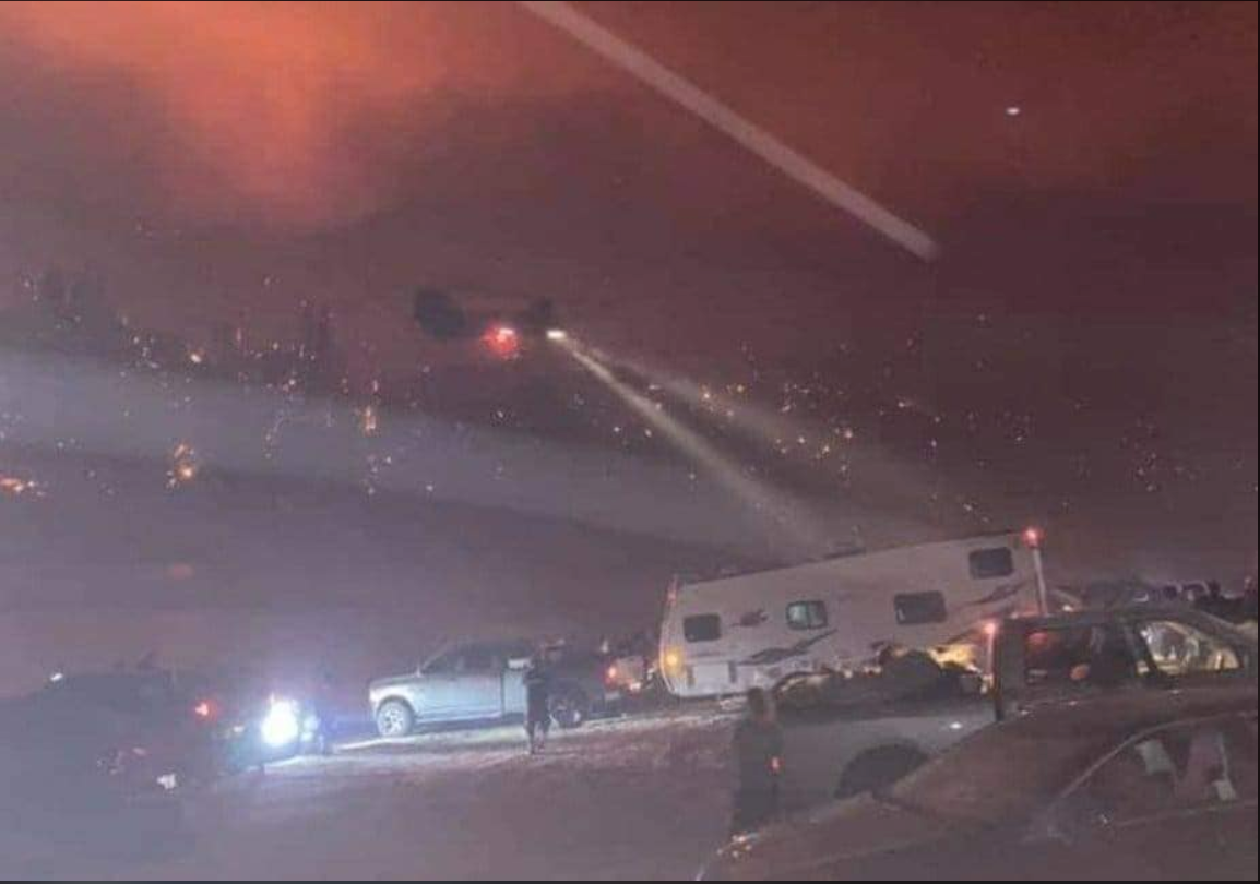 A screencap of the California National Guard rescuing people from a wildfire.