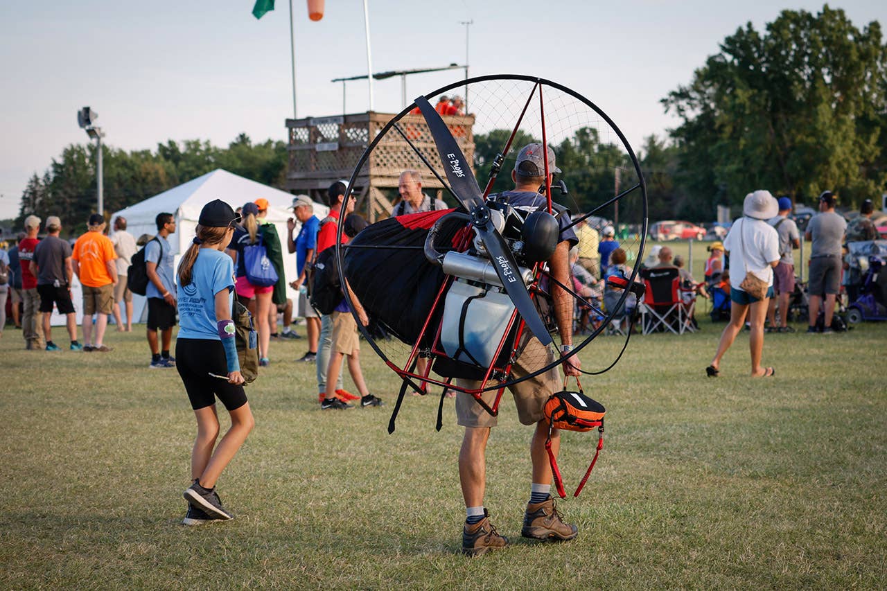 Off to fly with his powered parachute - EAA AirVenture Oshkosh 2022