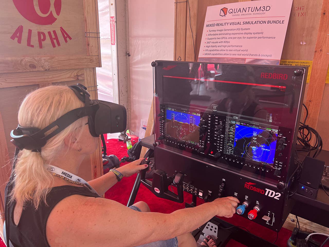 Plane & Pilot's Editor-in-Chief Isabel Goyer trying out Redbird’s Mixed-Reality Simulator.