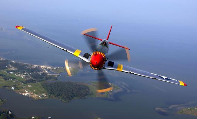 A P-51 in the colors of the Tuskegee Airmen