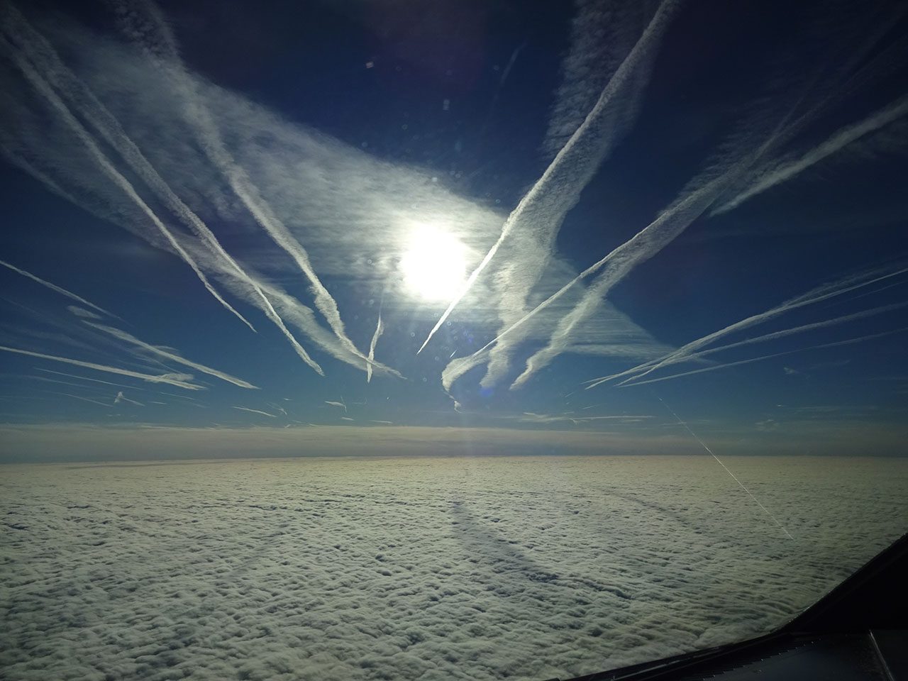THIRD PLACE: Contrails, Contrails, And More Contrails by Greg Pfeil